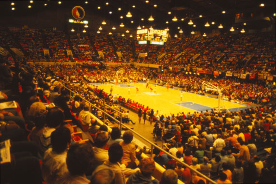 The girls state high school tournament regularly filled the largest auditorium in Iowa, Veterans Memorial in Des Moines. On the floor, the three offensive players wait at half-court for a rebound or a scored goal.